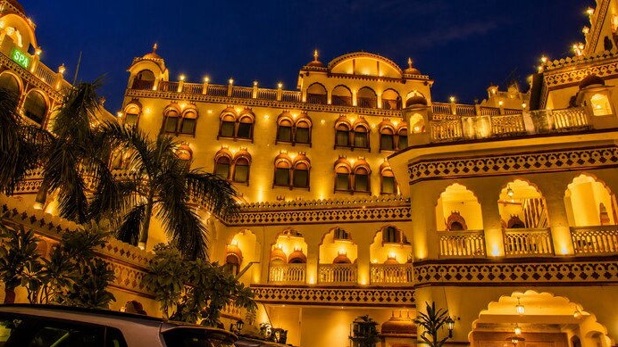 Fort Chandragupt Hotel exterior illuminated at night, Jaipur