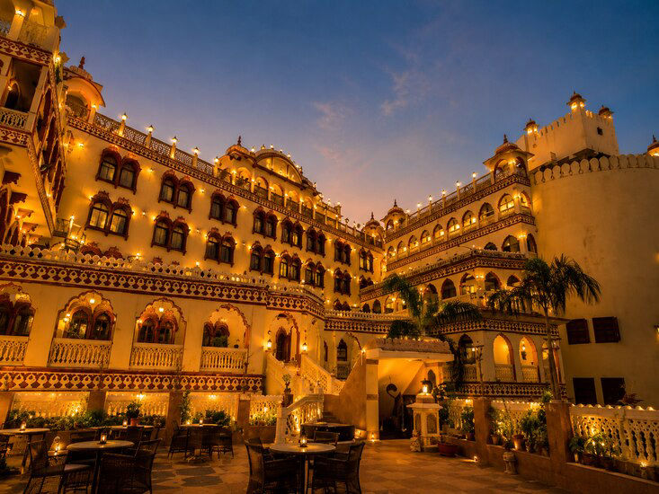 Fort Chandragupt Hotel heritage facade at twilight, Jaipur