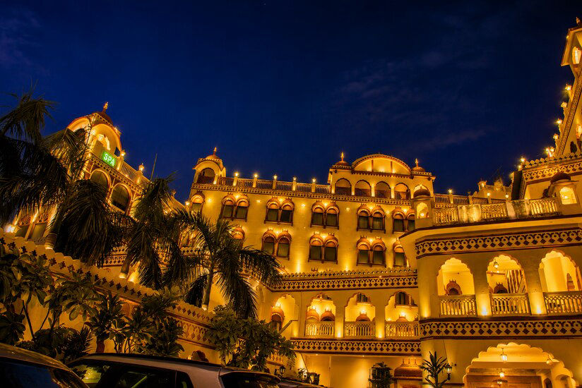 Fort Chandragupt Hotel illuminated facade at night, Jaipur