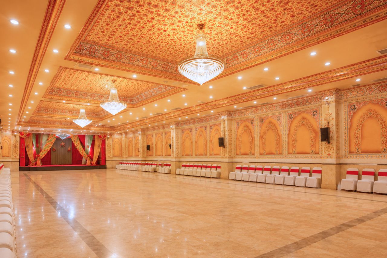 Magad Banquet Hall with theatre-style seating and decorated stage at Fort Chandragupt Hotel Jaipur