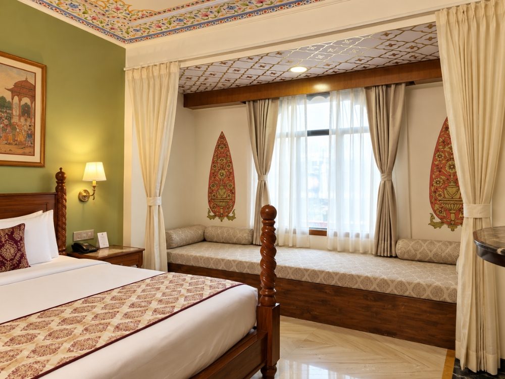 Suite Room window seating nook with curtains at Fort Chandragupt Hotel Jaipur